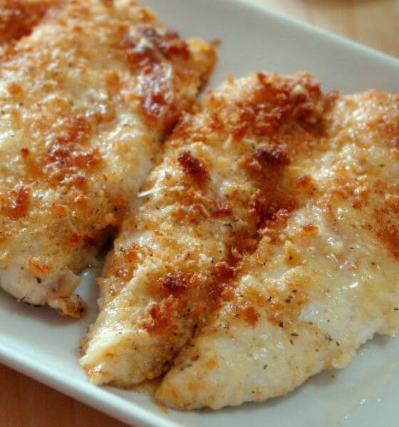 Parmesan crusted chicken on white plate