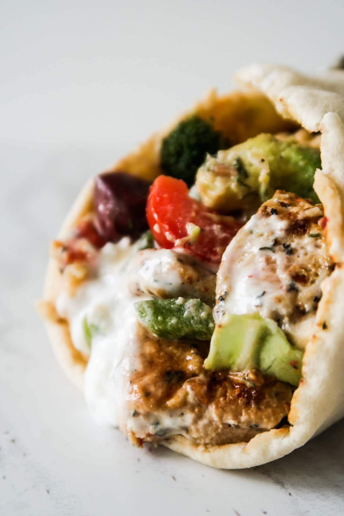 Amazing Mediterranean Chicken Wraps With garlicky yogurt sauce and hummus! These healthy wraps are a delicious healthy dinner recipe that everyone at your dinner table will love! This Mediterranean recipe is quite easy, uses simple ingredients and ready in about 30 minutes when you multi-task!
